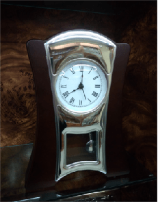 Reloj plata y madera pendulo - 160€