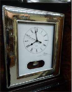Reloj plata y madera pendulo - 180€